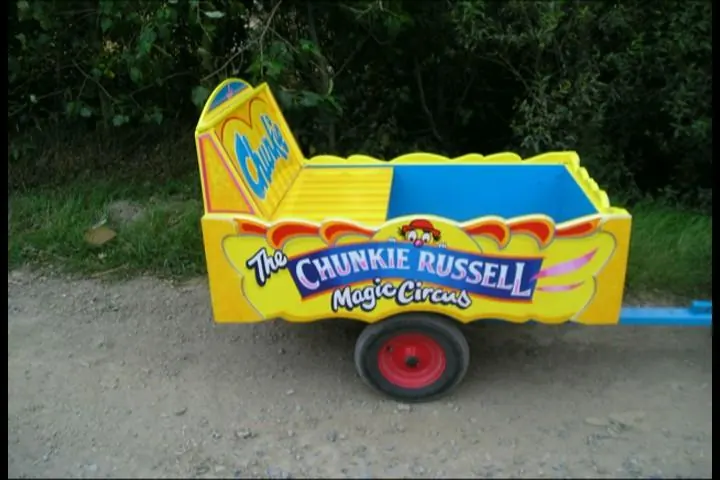 The yellow Chunkie Russell clown car at an outdoor family event