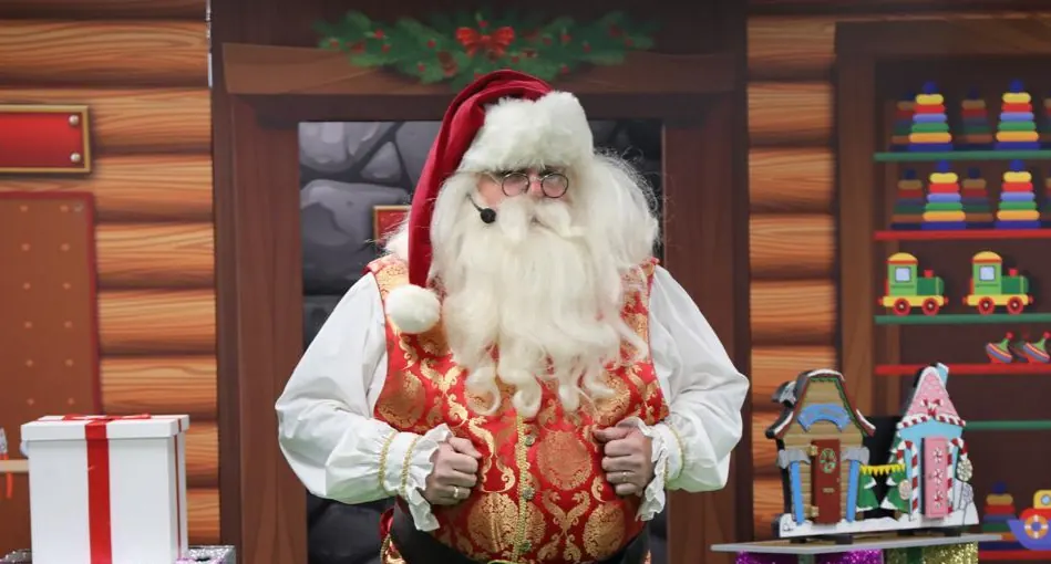 Chunkie as Father Christmas in a traditional red and gold suit