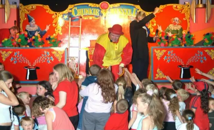 Children gathered around the stage at a Chunkie Russell show