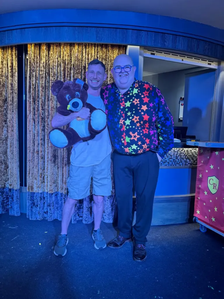 Chunkie Russell meeting a young fan and their teddy after a show